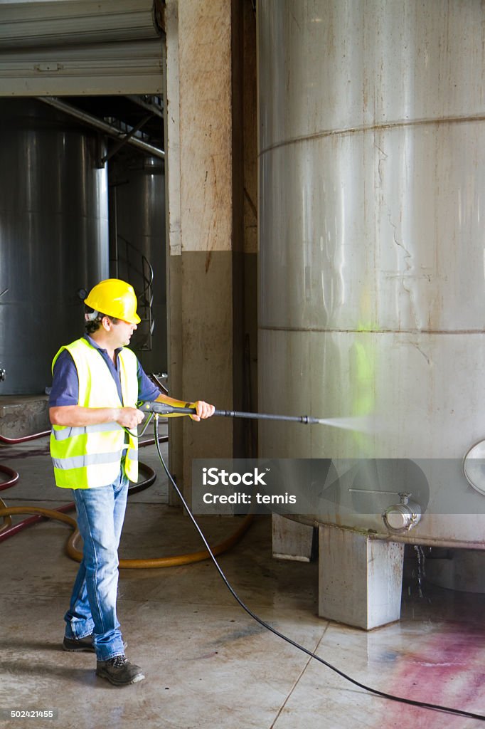 man washing around the industrial site