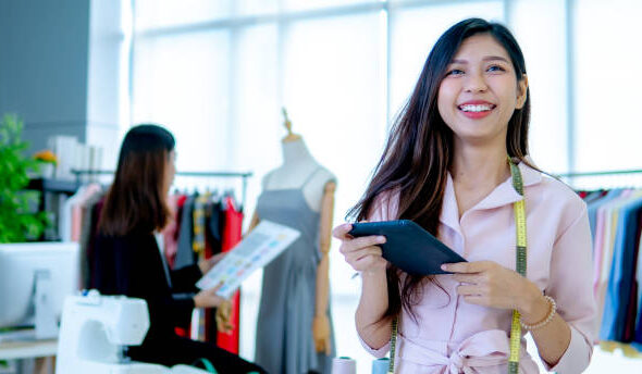 Portrait of beautiful young designer smiling in the store