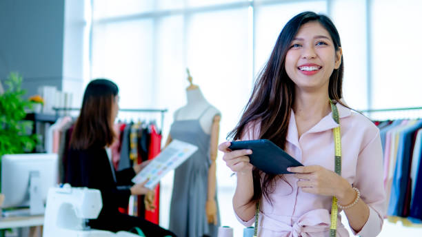 Portrait of beautiful young designer smiling in the store